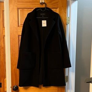 Black coat. 2 pockets. NWT